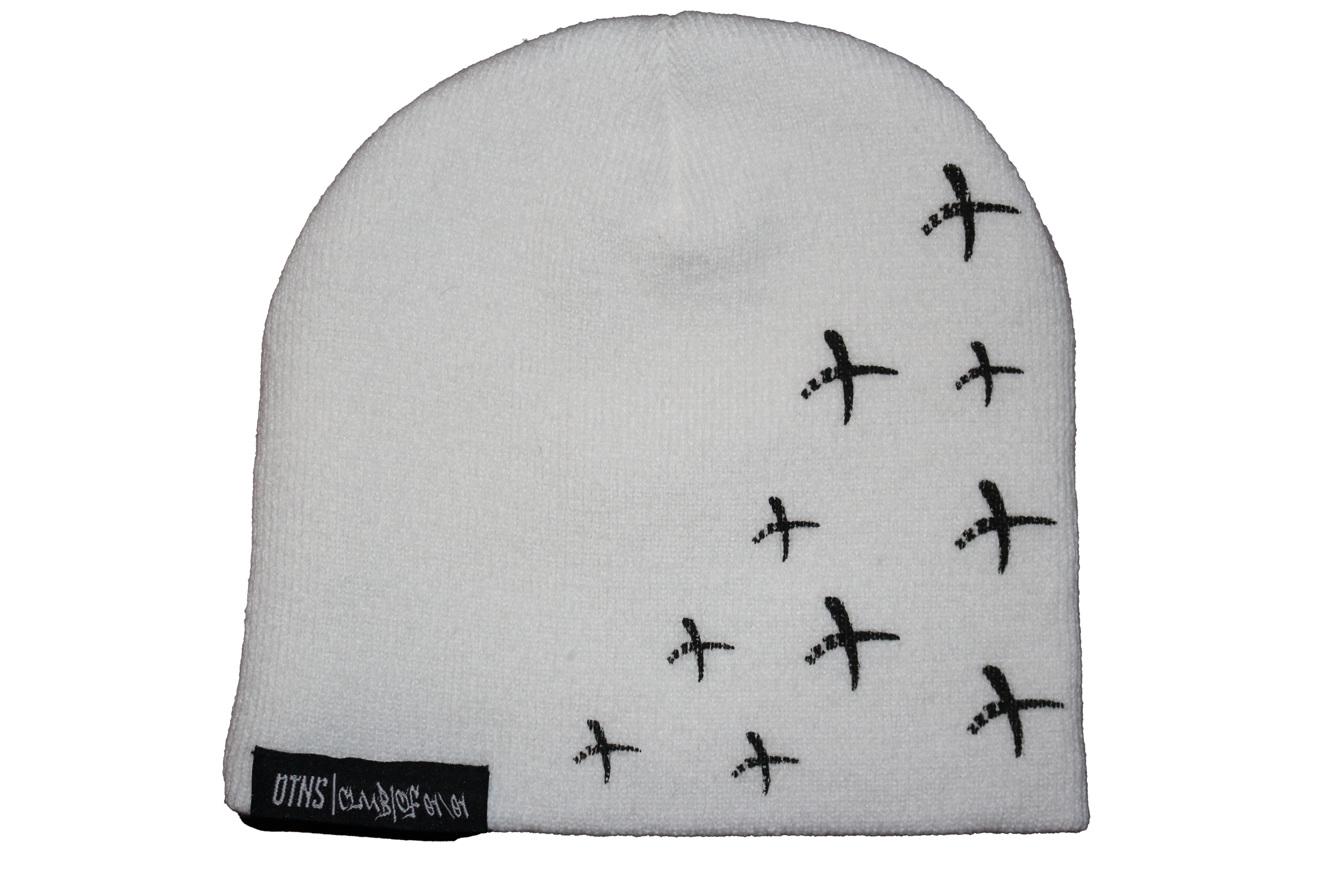 White OTNS beanie with black cross design and woven tags, stylish and warm perfect for Y2K fashion.