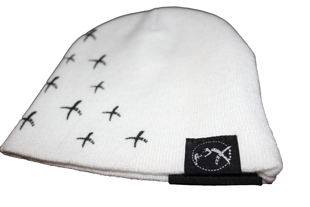 Stylish white OTNS Beanie with black stitched detailing and logo, perfect for Y2K fashion enthusiasts.