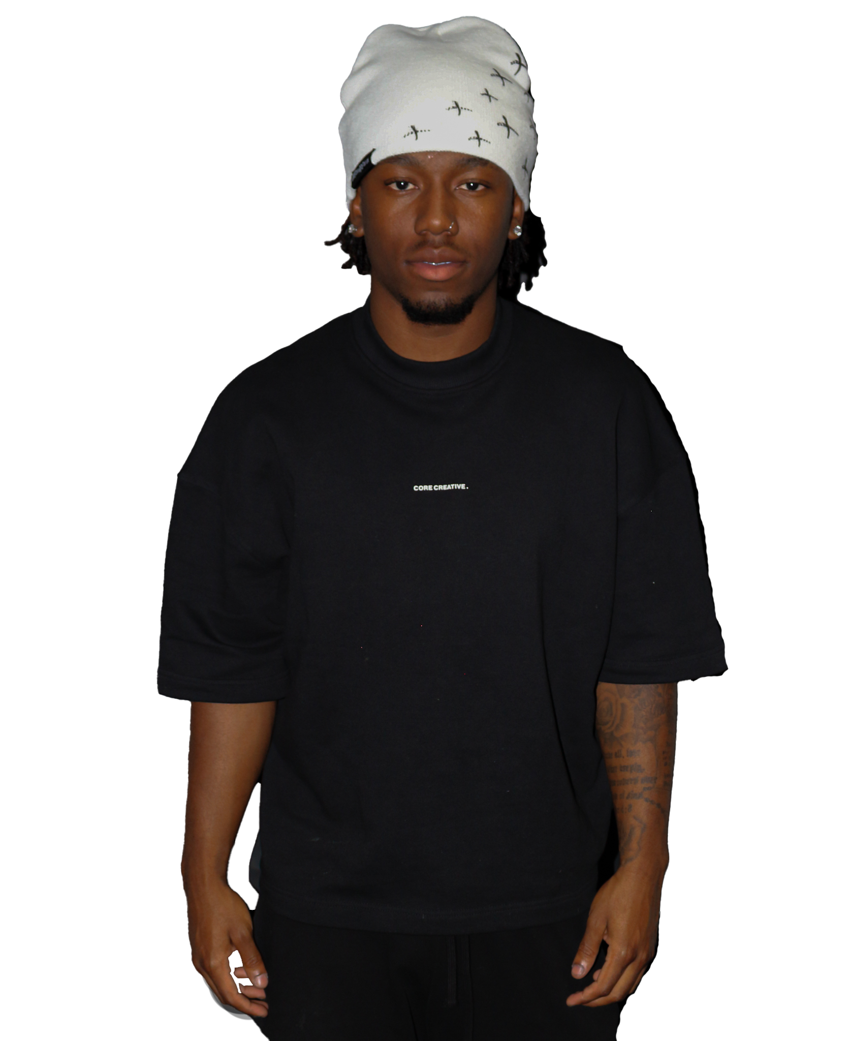 Model wearing a black oversized t-shirt and a stylish white beanie.